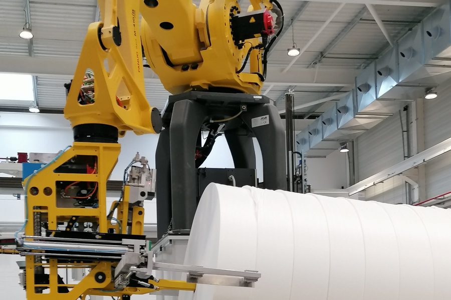 FANUC robot handling nonwoven roll — packaging production cell